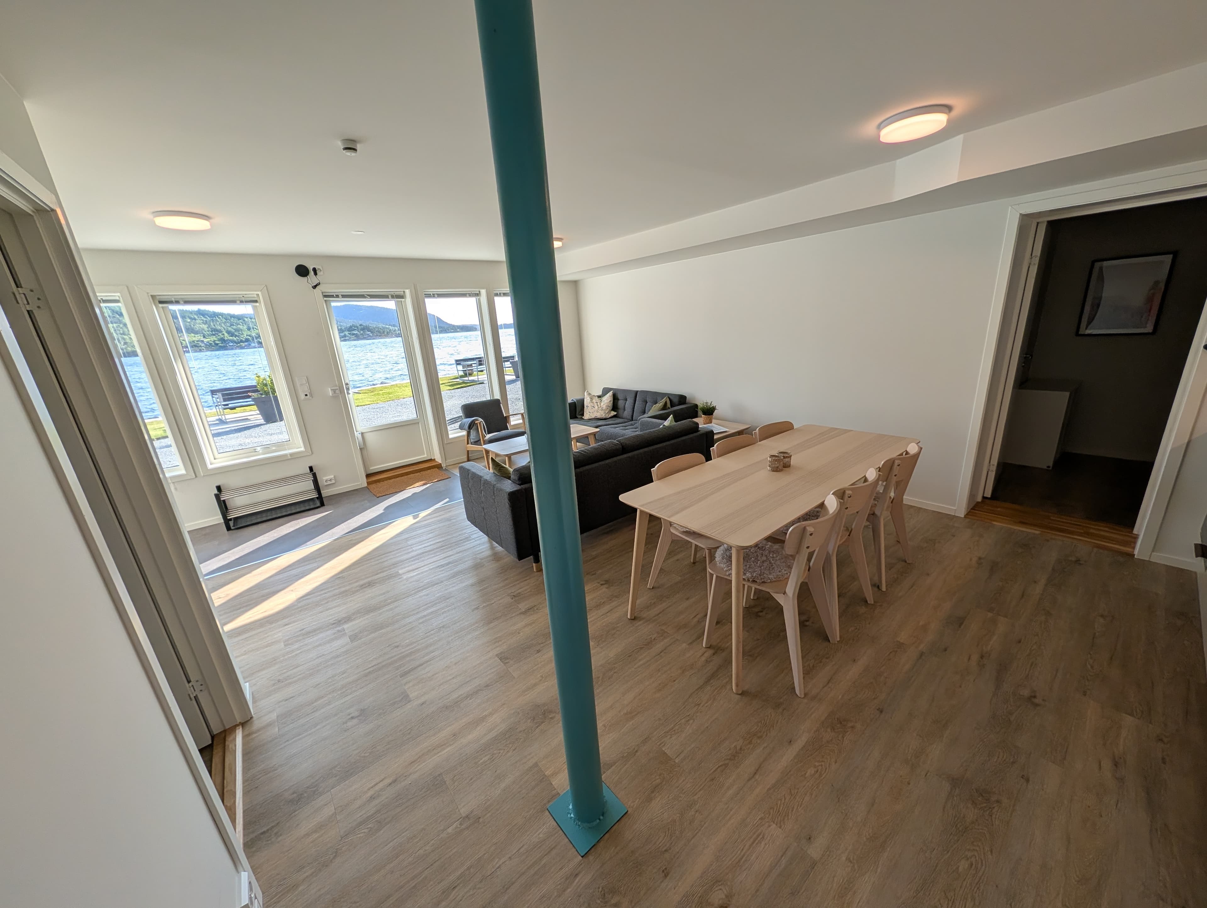 Living room with large sea-facing windows in a Type A apartment
